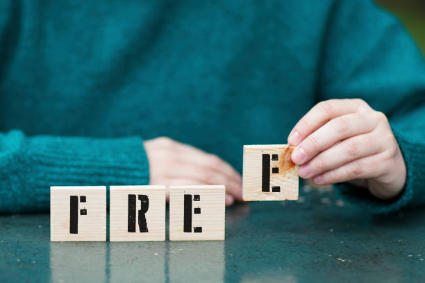 istock Free , Hand playing with four wooden blocks 949931038