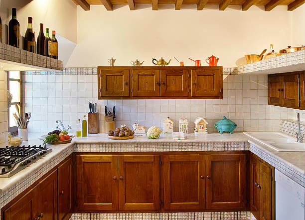Wooden and marble kitchen in a beautiful italian rustic house stock photo