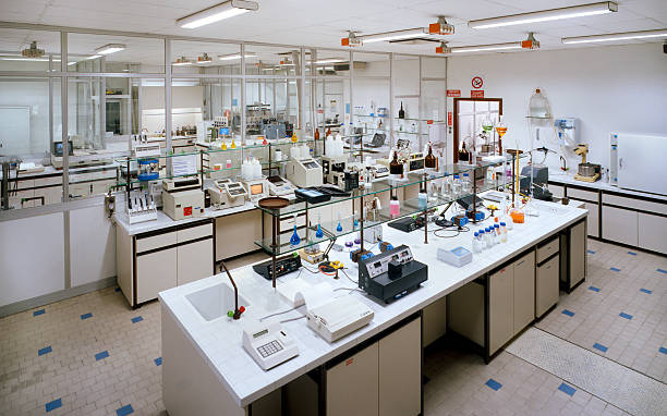 Chemical research laboratory with many instruments on the tables stock photo