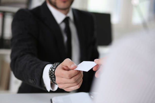 istock man give businesscard in office 949939140