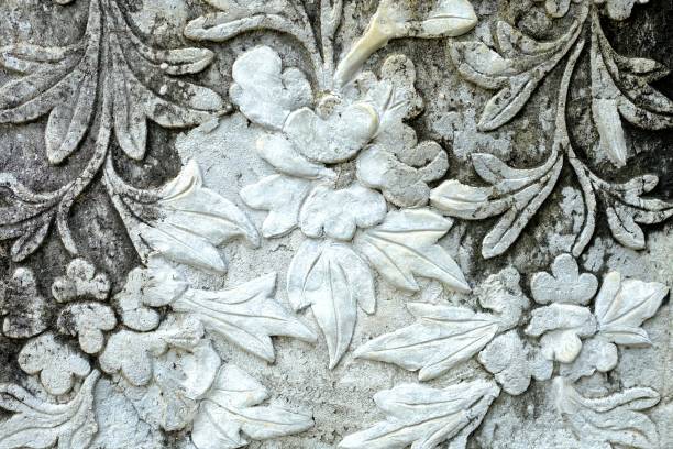 istock Vintage Thai Sculpture on Stone Wall. 949940124