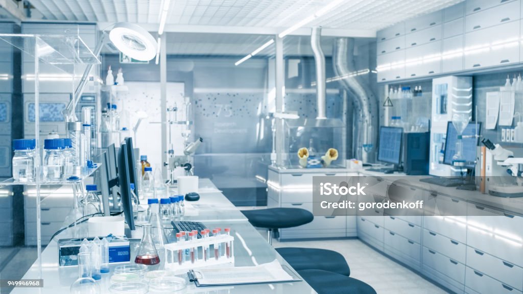 Bright and Ultra Modern High Tech Laboratory Full of Advanced Technological Wonders, Computers, Analyzing Machines, Test Tubes and Beakers. Laboratory Stock Photo