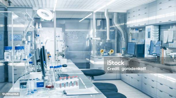 Bright And Ultra Modern High Tech Laboratory Full Of Advanced Technological Wonders Computers Analyzing Machines Test Tubes And Beakers Stock Photo - Download Image Now