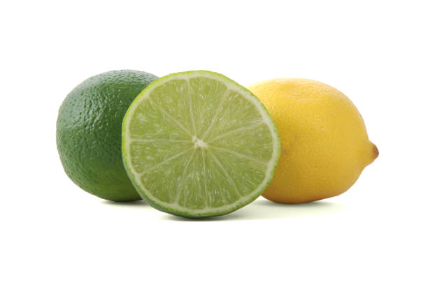 istock Lemon and cut-open lime isolated on white, cocktail ingredients 94995159