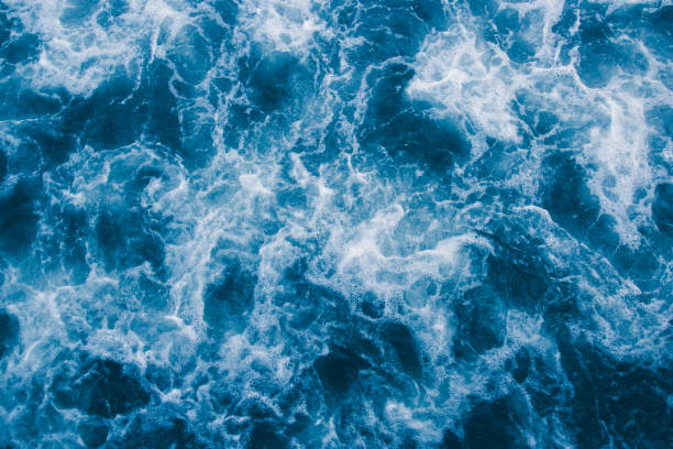 istock Abstract blue sea waves with white foam  for background, natural summer background, pattern concept 949951674