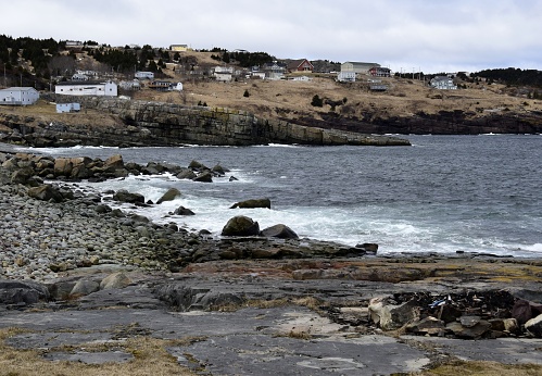 view along the end of the bay with the village of Flatrock in the background, Early Spring scene, Newfoundland Canada