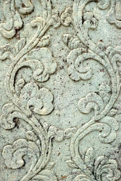 istock Vintage Thai Sculpture on Stone Wall. 949960308