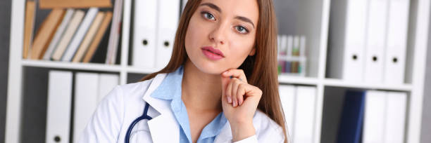 istock Female doctor hold hold in arm silver pen 949960394