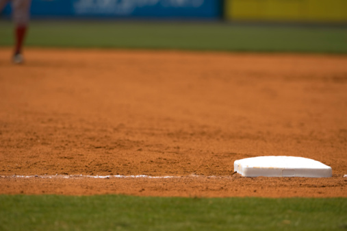 Baseball base and chalked base line in diamond