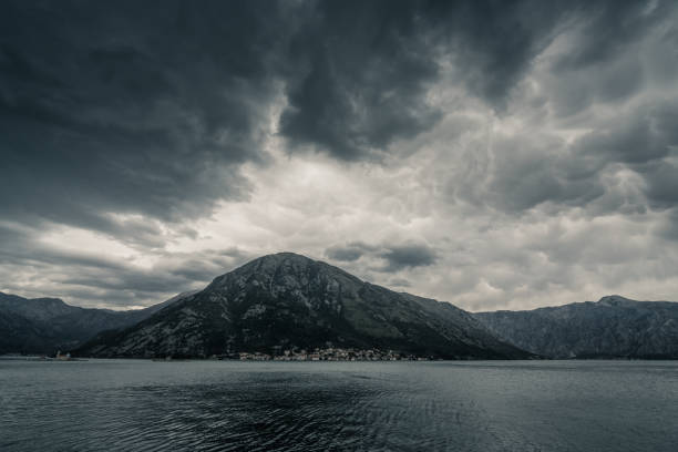 Dramatic cloudy landscape of a mountain on the coast of Bay of Kotor in Montenegro