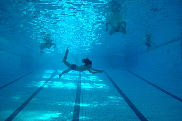 istock under water: diving woman in the pool 94997498