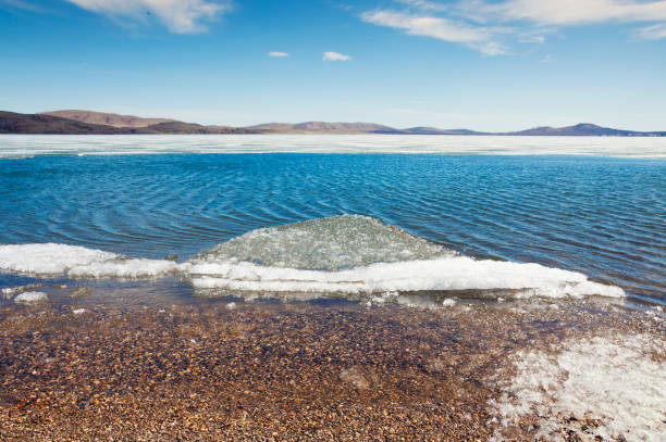 Melting ice on the lake. Beautiful spring landscape