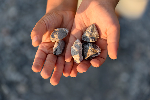 Children plays with stones