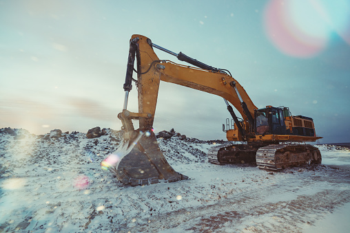 Excavator on a Winter construction site.