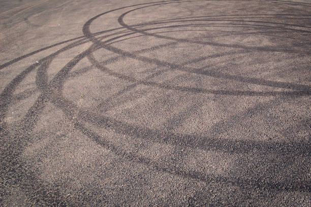 istock Urban background with tire tracks on the asphalt. 950005446