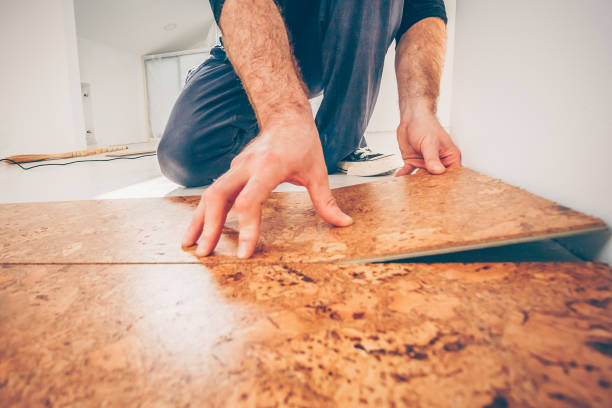 istock Master class for laying cork flooring, installation of a cork floor by a floating method 950005976