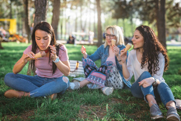 istock Eating ice cream with friends in the park 950010350