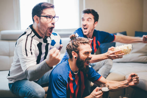 istock Excited people watching soccer game 950020150