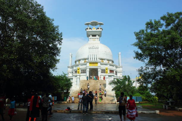 Buddhist Dhauli Shanti Stupa at Dhauligiri near Bhubaneswar city in Odisha, India Tourists visit Buddhist Dhauli Shanti Stupa at Dhauligiri near Bhubaneswar city in Odisha, India. This hill has major Edicts of Ashoka engraved on a mass of rock, from the times of great Indian king Ashoka after famous Kalinga war during 2nd to 5th BC. bhubaneswar stock pictures, royalty-free photos & images