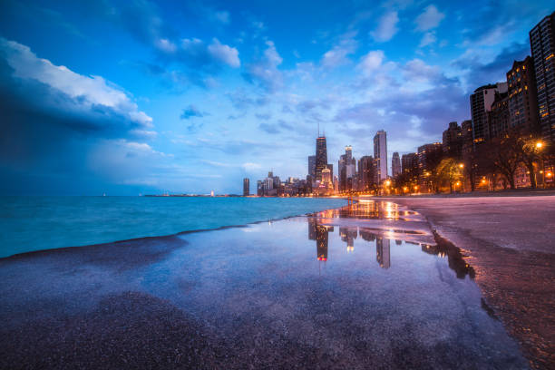 Sunset Reflection at North Beach Ave Moody blue sky over North Beach Ave in Chicago chicago illinois stock pictures, royalty-free photos & images