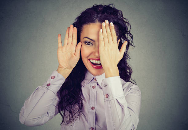 istock Funny woman revealing face and smiling 950027850