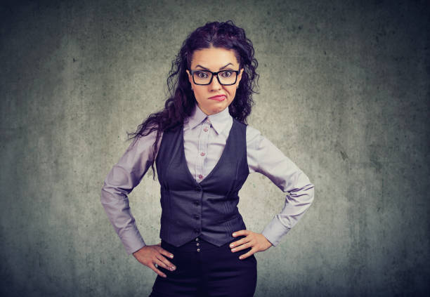 Annoyed formal girl in glasses
