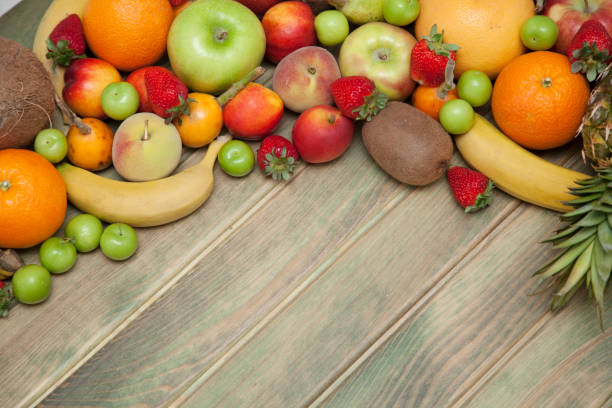 istock Fruits on wooden background. 950031186