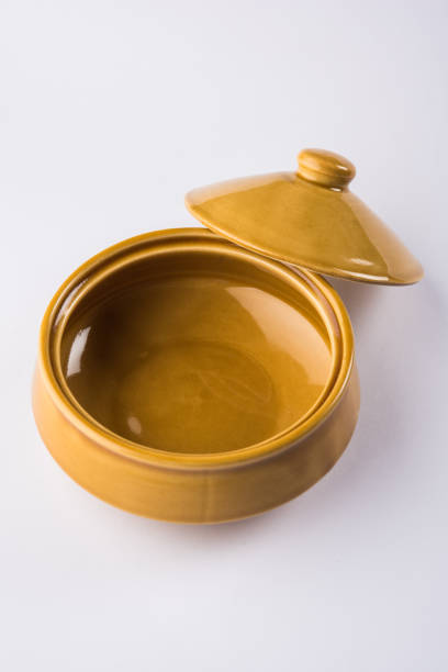 istock Yellow empty ceramic bowl or container with lid or barni, isolated over plain background 950035612