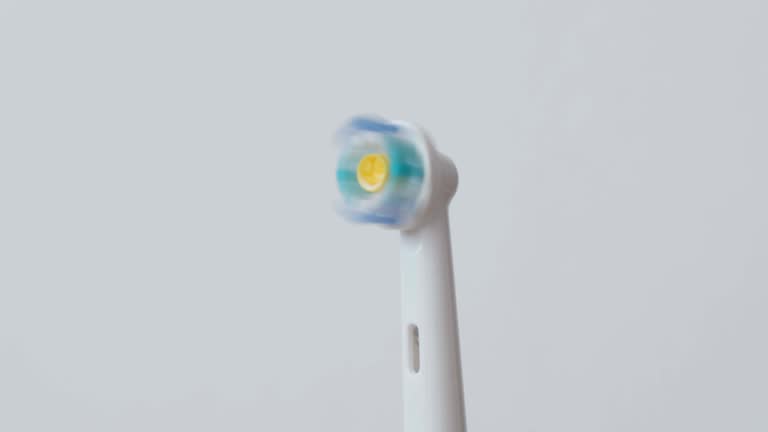 White electric toothbrushes with rotating head on and off