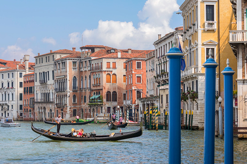Traditional gondolas on the Grand Canal in Venice on a summer day.