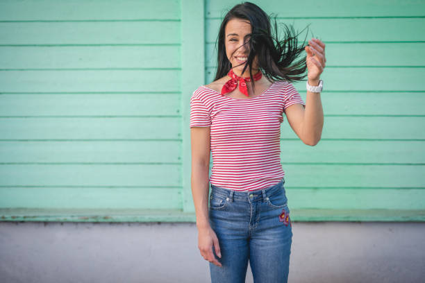 Gorgeous, modern and young woman, spending her leisure time on a spring day in the city.