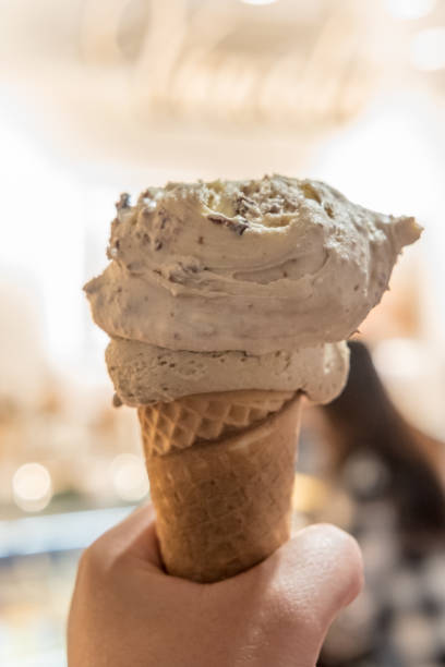 istock Hand holding Chocolate Gelato, Ice-cream with blur background. 950046548
