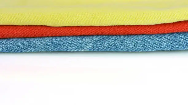 Photo of Colorful denim or jeans fabric on white background