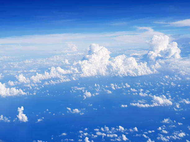 above the clouds in the sky. view from above the clouds. flying over clouds in plane. space boundless. weather and climate. big clouds. atmosphere and stratosphere. meteorology and aircraft. - cloud cloudscape stratosphere above imagens e fotografias de stock