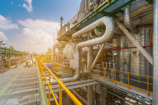 istock Oil petroleum plant with sun light flare 950050496