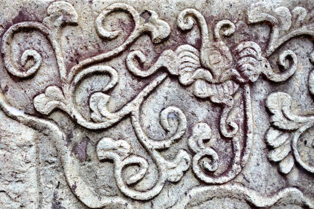 istock Vintage Thai Sculpture on Stone Wall. 950052834