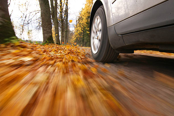 Car driving on country road stock photo