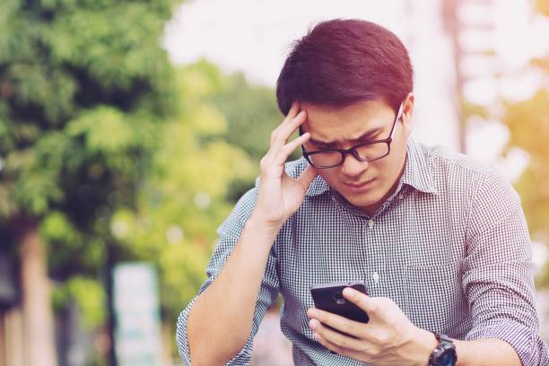 istock Handsome Business man in an using telephone Notifications bad news. 950057344