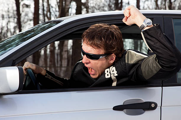 Aggressive driver swearing stock photo