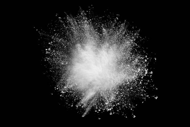 istock Launched white powder splash on black background. Bizarre forms of of white powder explosion cloud against dark background. 950060736