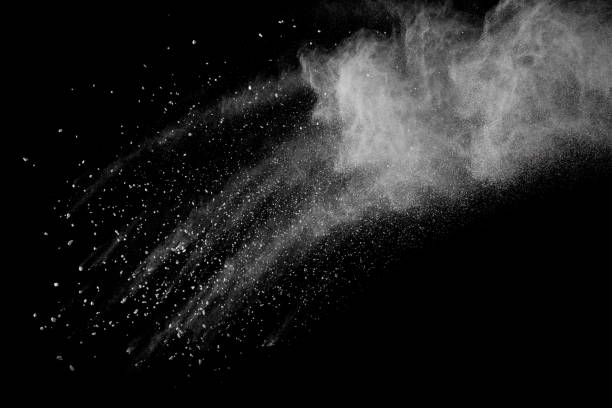 istock Launched white powder splash on black background. Bizarre forms of of white powder explosion cloud against dark background. 950060768