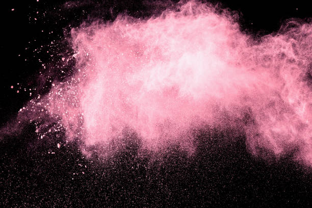 istock abstract pink dust explosion on  black background. abstract pink powder splattered on black background, Freeze motion of pink powder splash. 950061002
