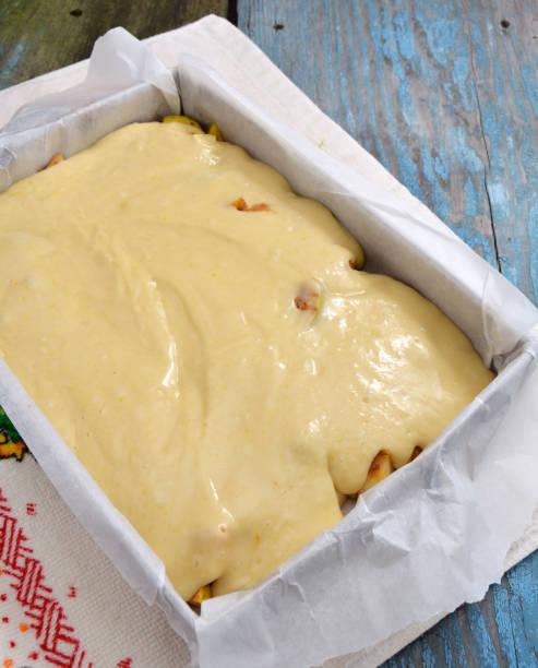istock Dough with apples on a baking sheet for roasting. Not baked 950070548