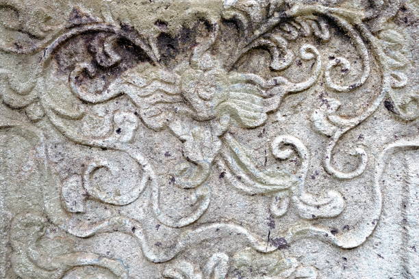 istock Vintage Thai Sculpture on Stone Wall. 950072624