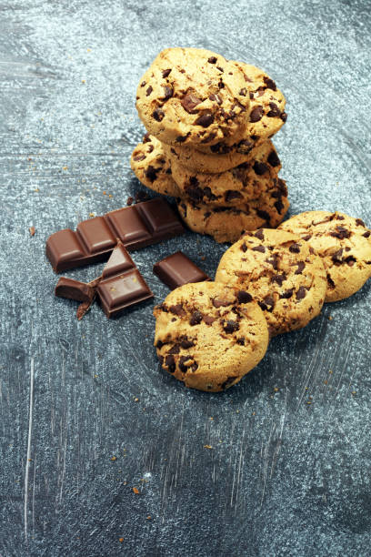 istock Chocolate cookies on rustic table. Chocolate chip cookies 950105888