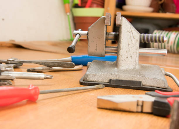 istock small portable vice screwdriver tools for repair  randomly scattered on the work surface 950107666