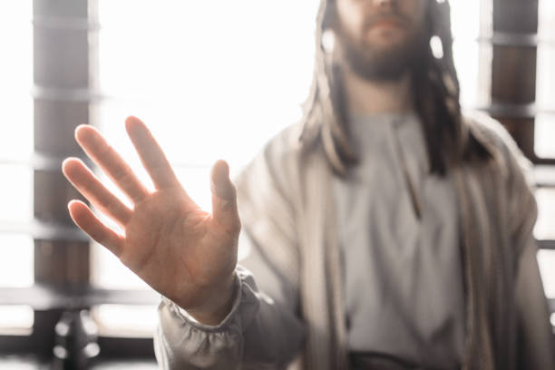 istock Jesus Christ reaching out his hand, peace symbol 950111282