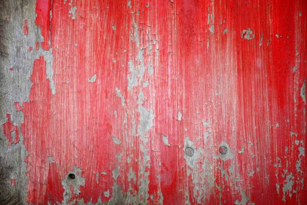 istock Red Peeling Paint on Old Wooden Wall Background. 950111788