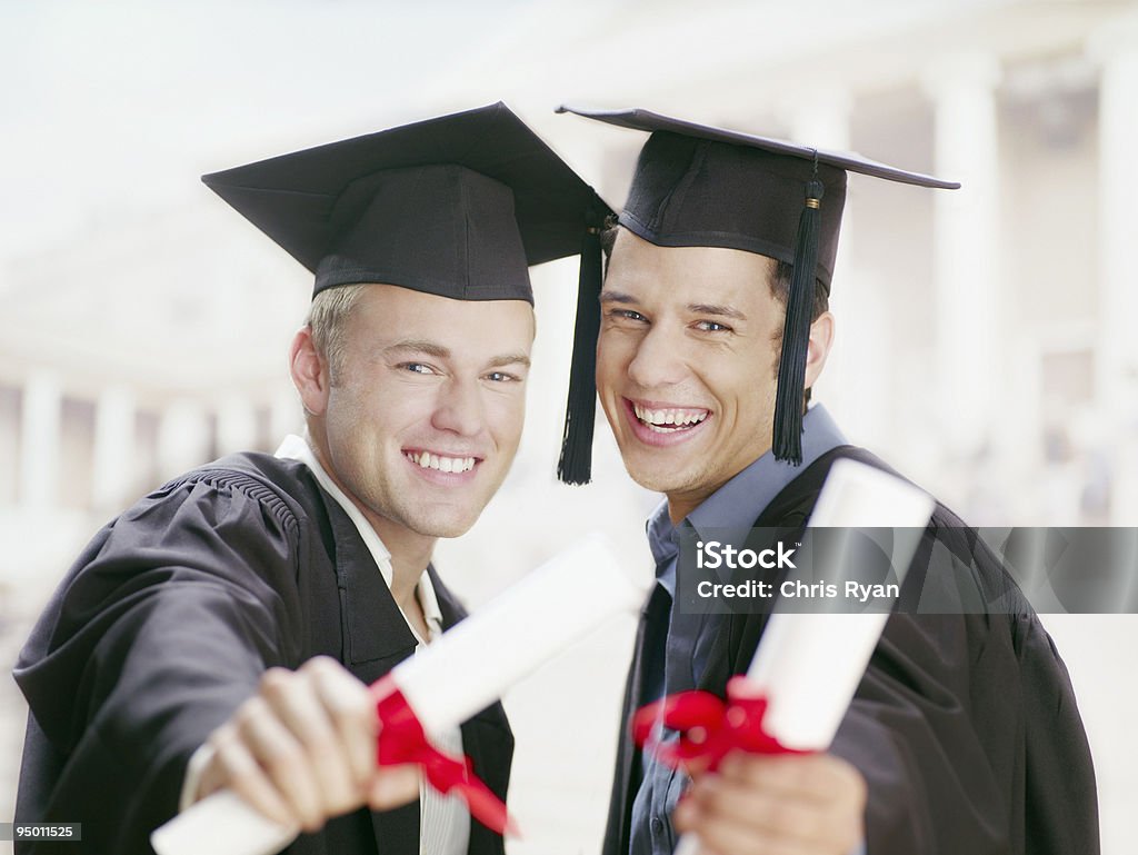 Graduates holding diplomas  20-24 Years Stock Photo