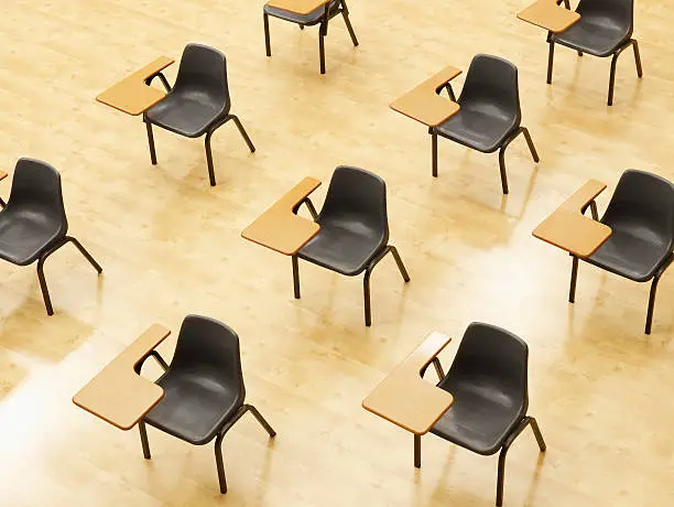 Photo of Desks in empty classroom